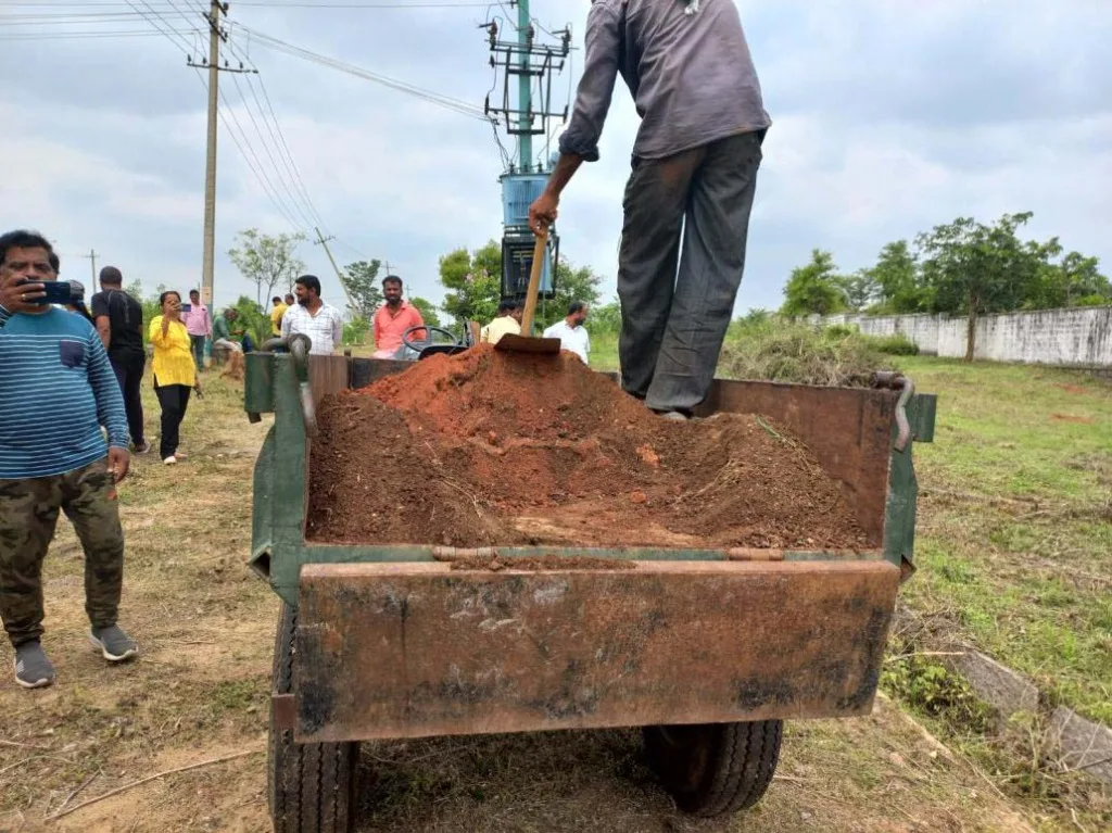 Volunteers planting saplings